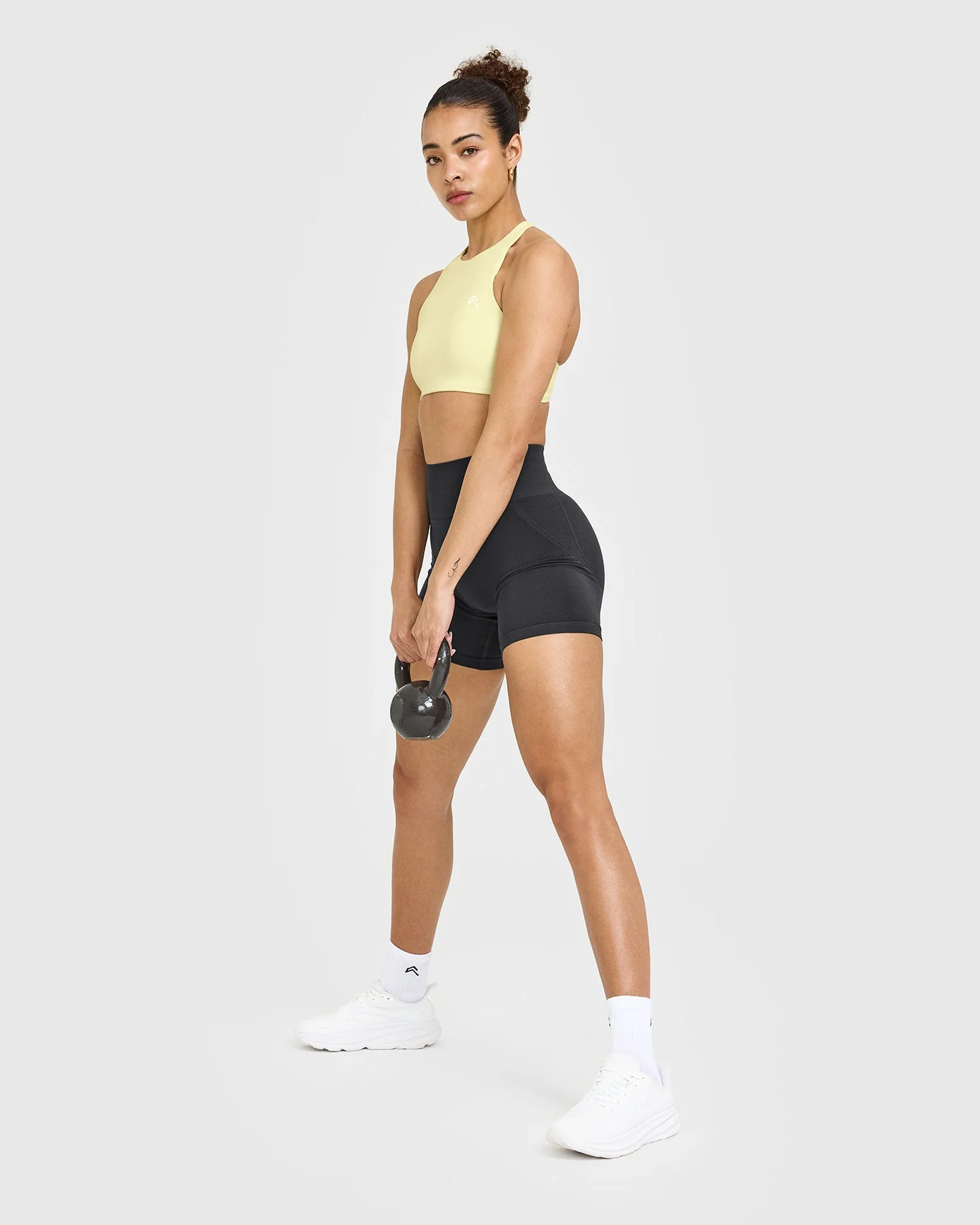 EasyLift™ High Neck Sports Bra with White Logo | Pastel Yellow - Image 3
