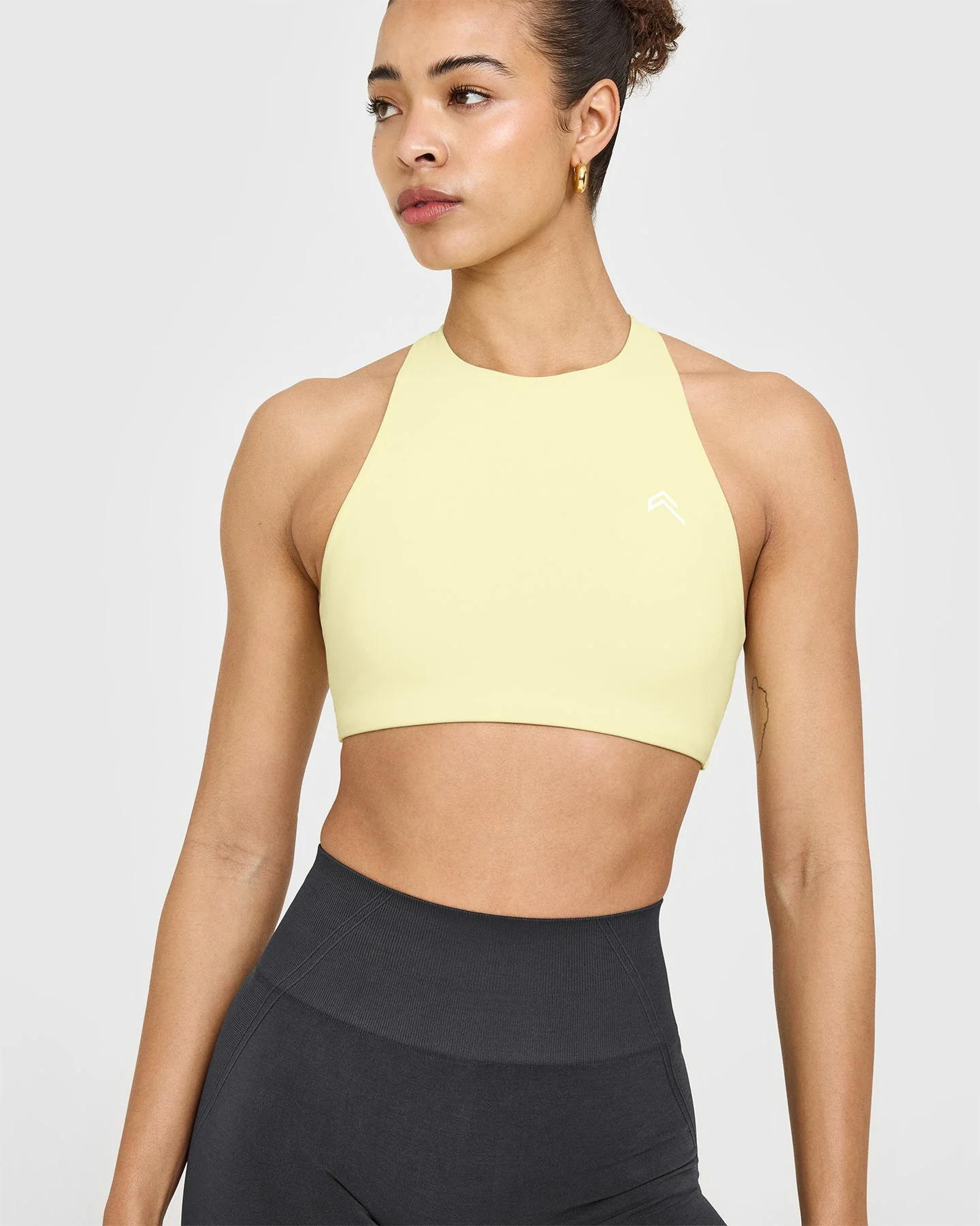 EasyLift™ High Neck Sports Bra with White Logo | Pastel Yellow - Image 4