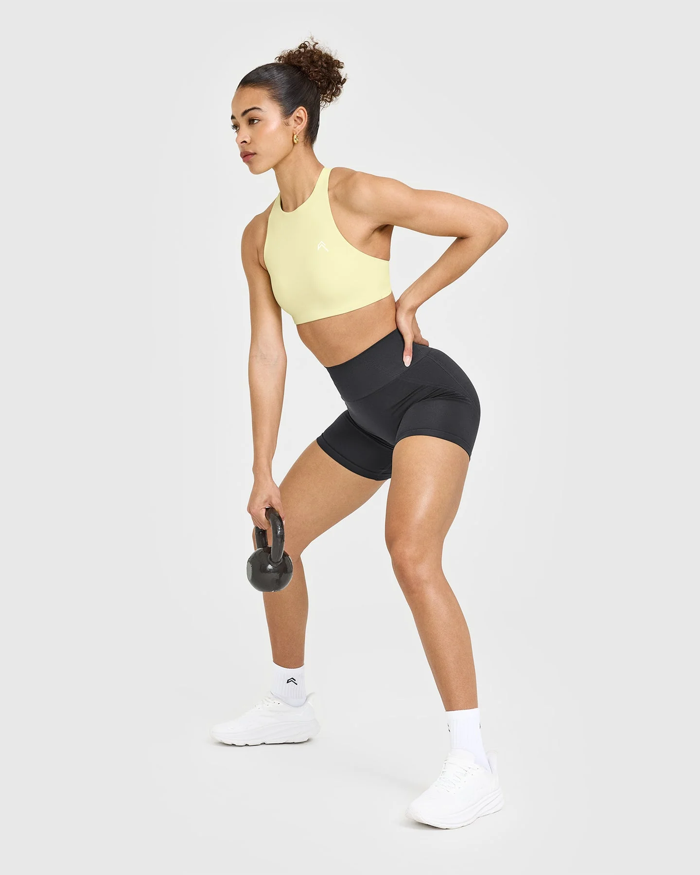 EasyLift™ High Neck Sports Bra with White Logo | Pastel Yellow - Image 6