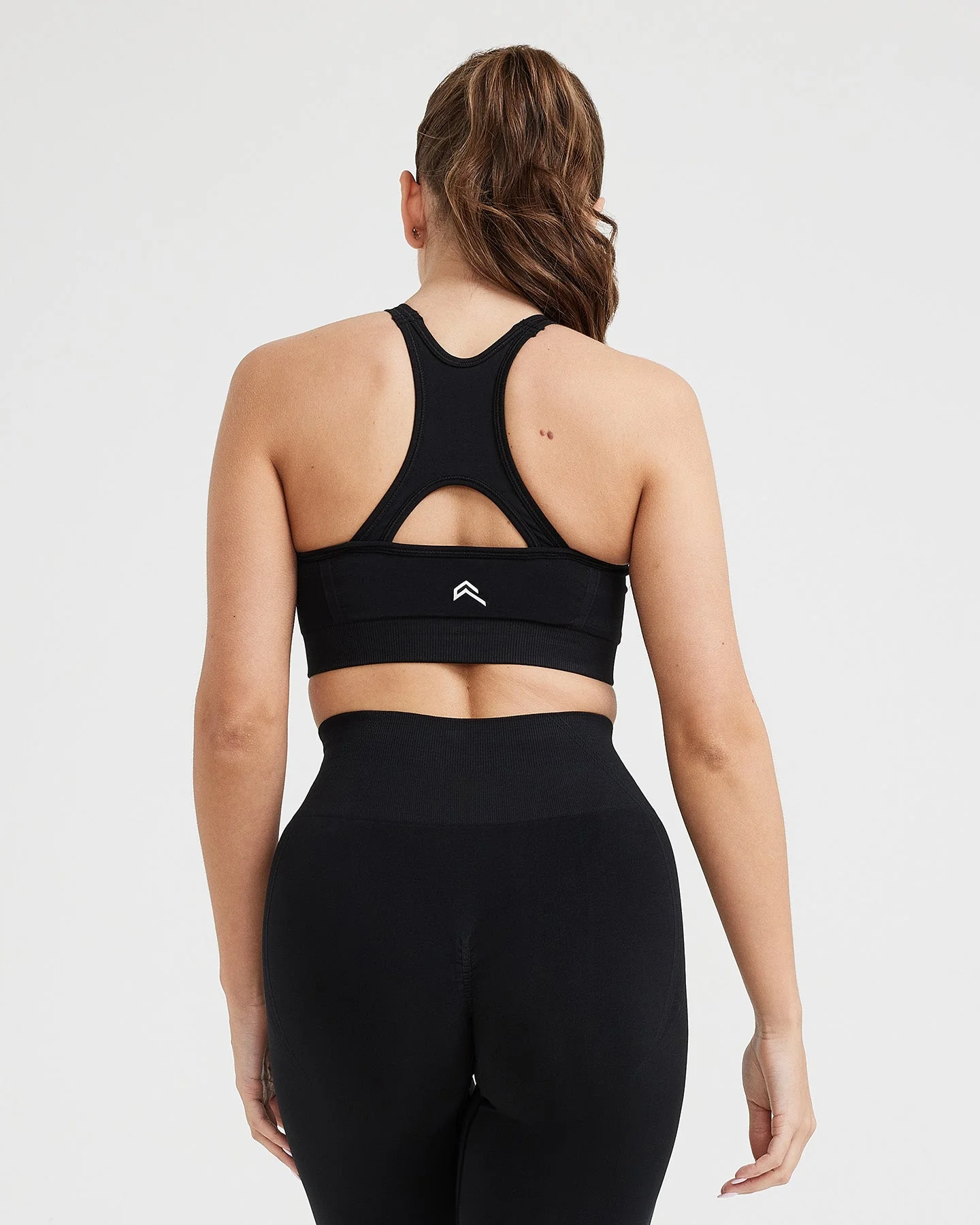 EffortlessLift™ Seamless High Neck Bralette with White Logo | Black - Image 4
