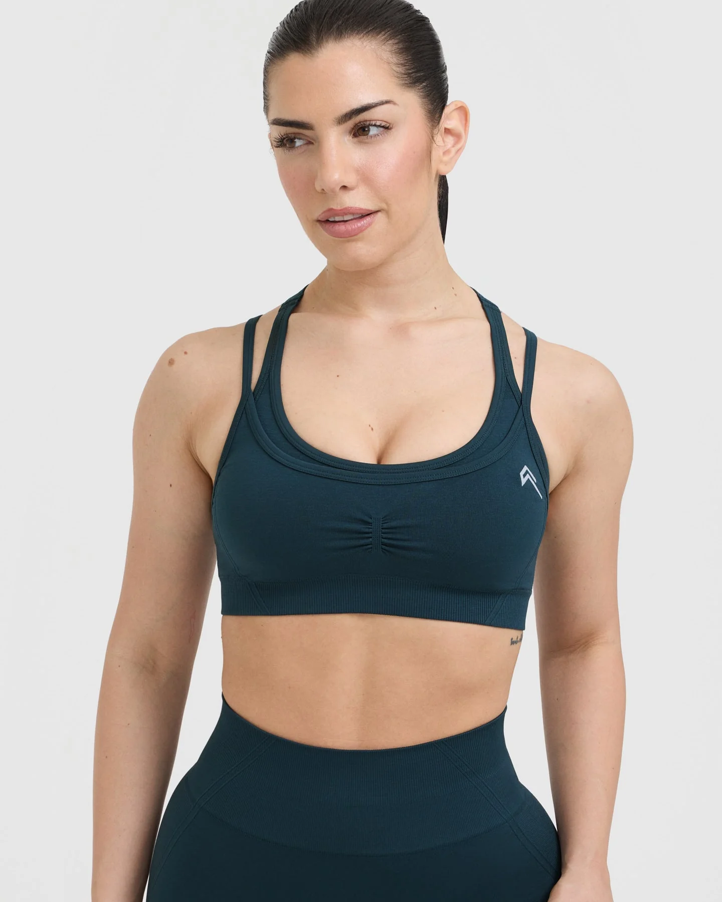 EffortlessLift™ Seamless Layered Sports Bra with White Logo | Oil Blue - Image 4