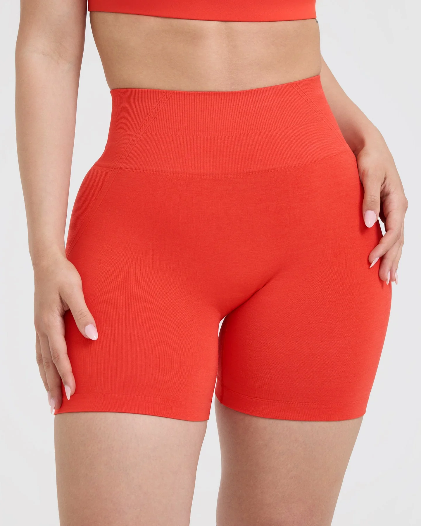 EffortlessLift™ Seamless Shorts with White Logo | Charged Orange - Image 4