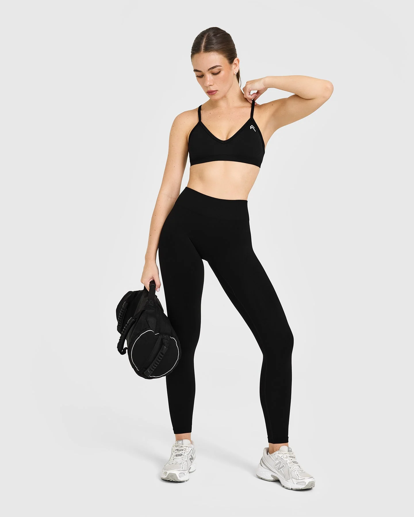 EnhanceLift™ Seamless Strappy Sports Bra with White Logo | Black - Image 3