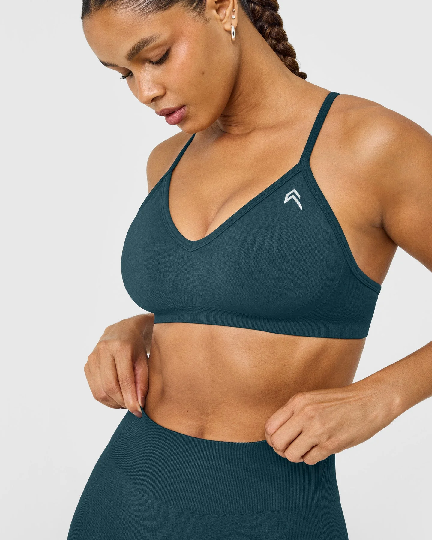 EnhanceLift™ Seamless Strappy Sports Bra with White Logo | Washed Oil Blue - Image 4