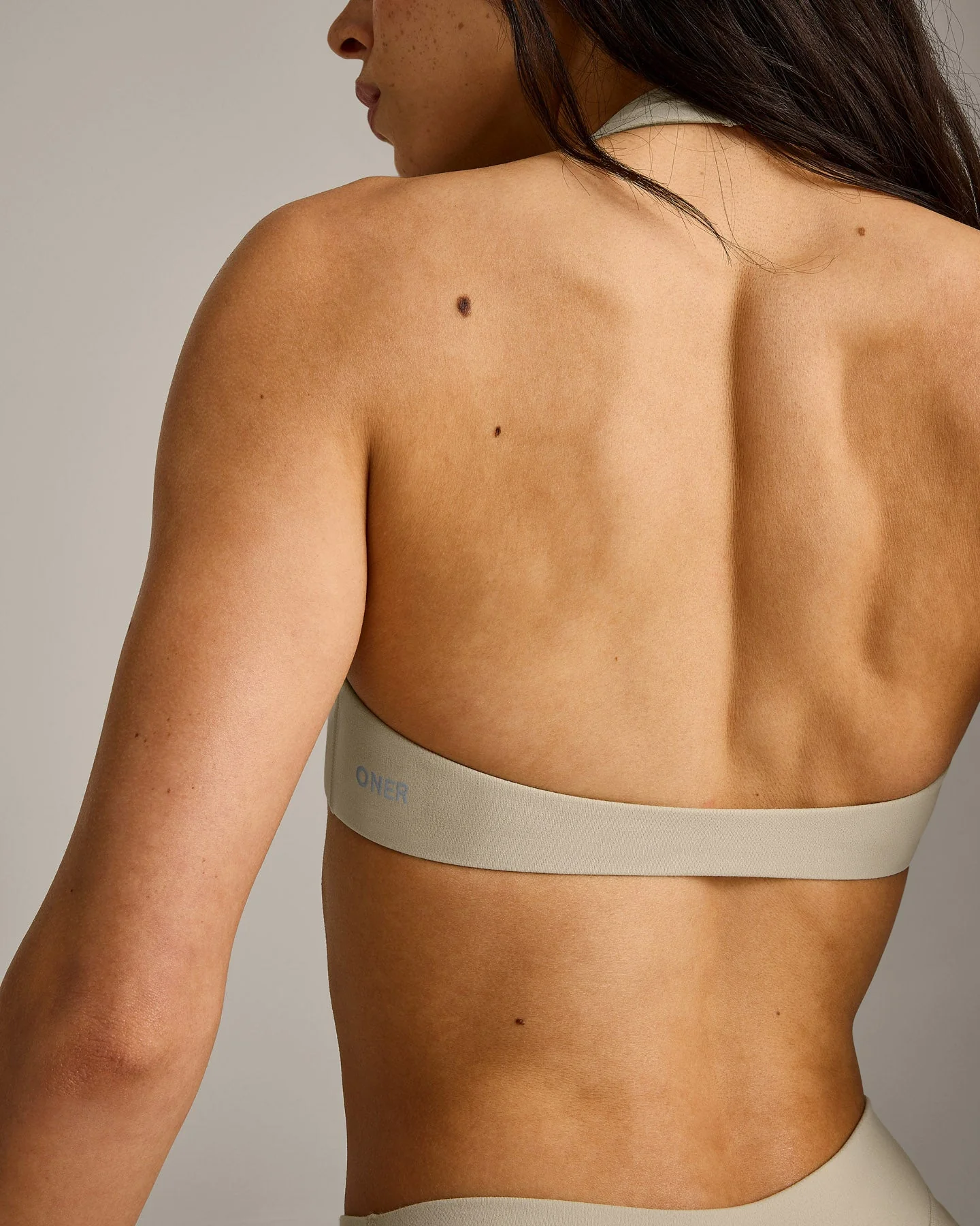 SoftMotion™ Minimal Halter Neck Bralette with Grey Logo | Oatmeal - Image 5