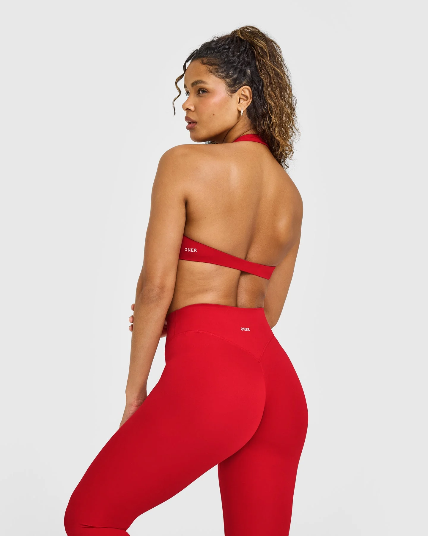SoftMotion™ Minimal Halter Neck Bralette with White Logo | Light Toasted Red - Image 4